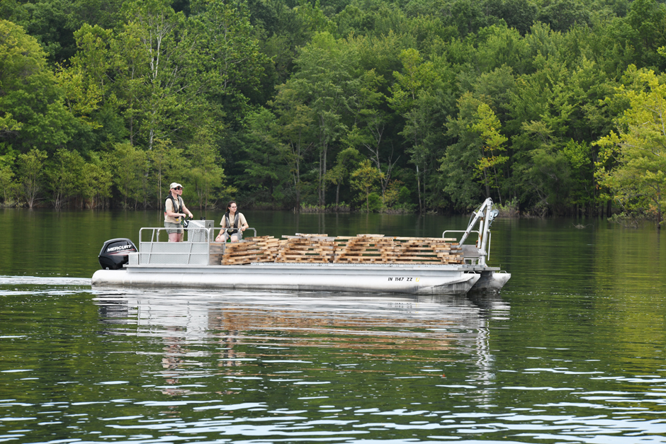 Fish habitat pontoon boat towing habitat structures 